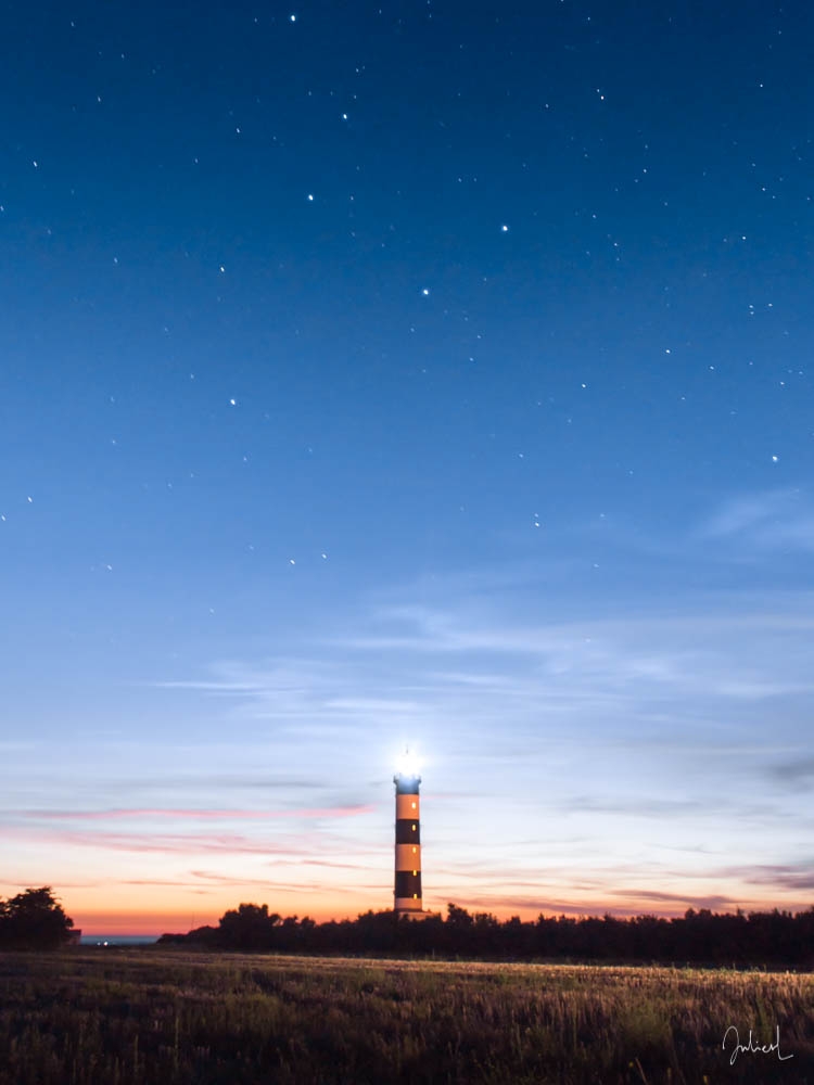 The lighthouse of Chassiron lighting up the stars, Ile d'Oléron, France